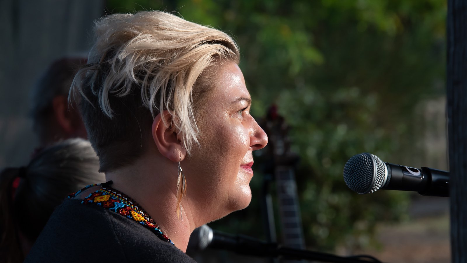 Suzanne Gay performing live at the microphone